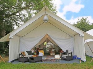 Safari tent glamping accommodation with en-suite bathroom for Glastonbury Fes