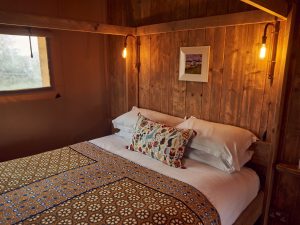 Inside bedroom Glastonbury glamping accommodation